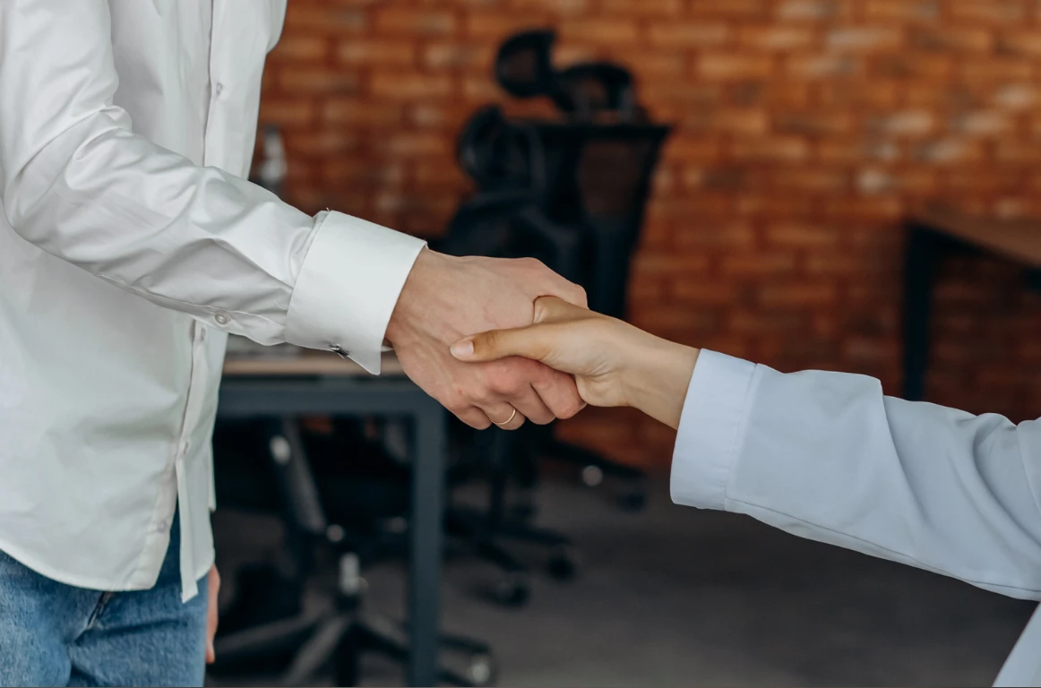 Shaking hands to show an agreement and trust for Mandy's Companion services. 